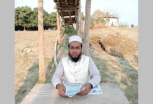 বাঁশের সাঁকোর নিচে বসে জাতীয় পার্টি প্রার্থীর নির্বাচনী ইশতেহার ঘোষণা