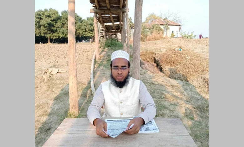 বাঁশের সাঁকোর নিচে বসে জাতীয় পার্টি প্রার্থীর নির্বাচনী ইশতেহার ঘোষণা